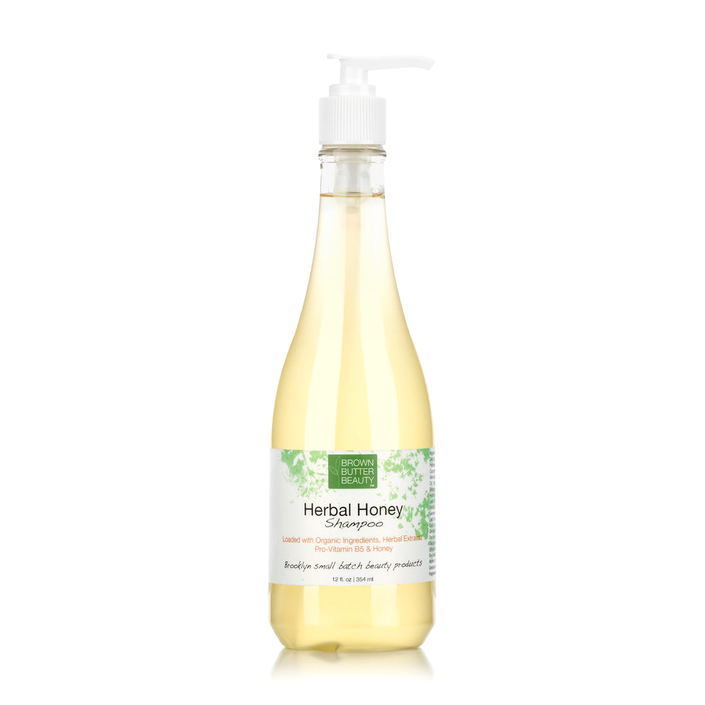 Gentle herbal-scented honey shampoo for nourishing hair care with organic oils and botanicals.